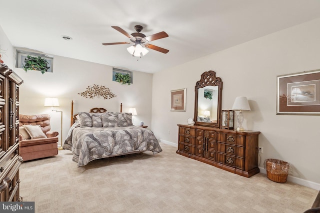 carpeted bedroom with ceiling fan, baseboards, and visible vents