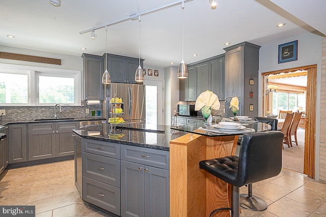 101 Andrea Rd, Cheltenham, PA 19012 - kitchen featuring stainless steel appliances, a sink, gray cabinets, track lighting, and recessed lighting