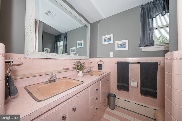 101 Andrea Rd, Cheltenham, PA 19012 - bathroom with tile walls, double vanity, wainscoting, and toilet