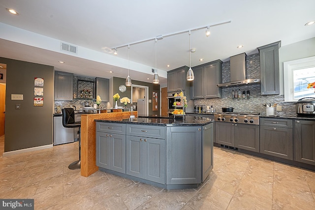 101 Andrea Rd, Cheltenham, PA 19012 - kitchen featuring wall chimney exhaust hood, stainless steel gas stovetop, a center island, gray cabinetry, and recessed lighting