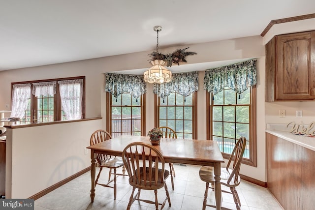 2744 Church Ln, Taneytown, MD 21787 - dining space with light tile patterned floors and a chandelier