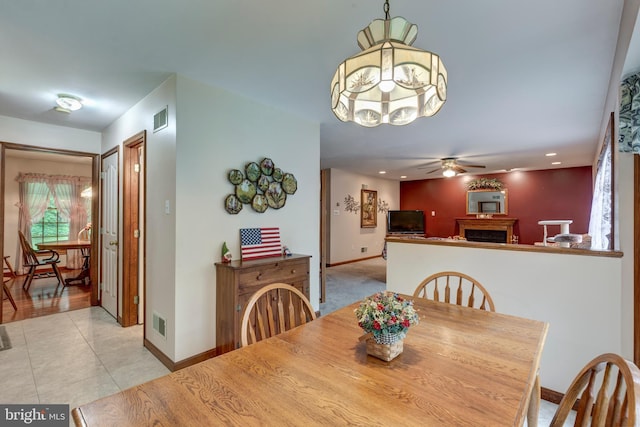 2744 Church Ln, Taneytown, MD 21787 - dining room featuring ceiling fan, a fireplace, light tile patterned flooring, and recessed lighting