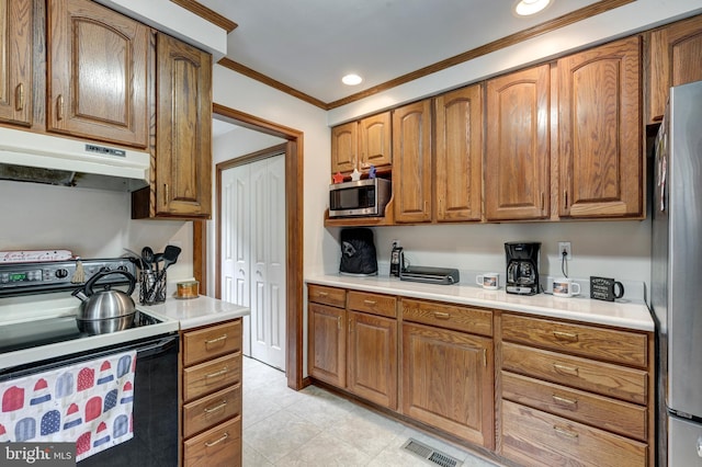 2744 Church Ln, Taneytown, MD 21787 - kitchen with stainless steel appliances, under cabinet range hood, brown cabinetry, ornamental molding, and recessed lighting
