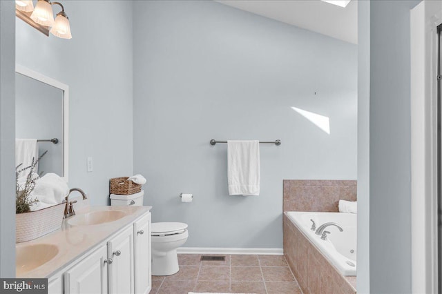 full bath with visible vents, baseboards, a sink, double vanity, and a garden tub