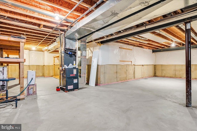unfinished below grade area featuring heating unit