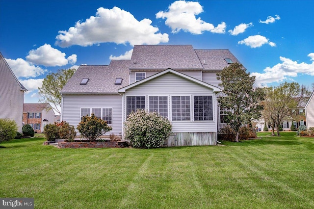 back of house featuring a lawn