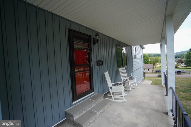 208 Drane Dr, Accident, MD 21520 - view of patio / terrace featuring covered porch and an attached carport