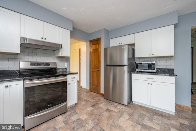 208 Drane Dr, Accident, MD 21520 - kitchen with dark countertops, under cabinet range hood, white cabinetry, and stainless steel appliances