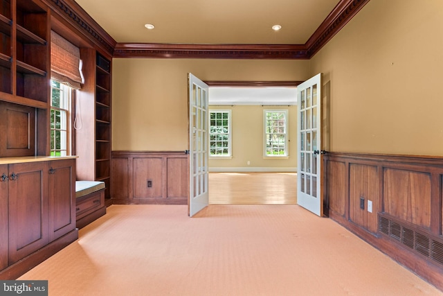607 Newtown Rd, Berwyn, PA 19312 - interior space featuring visible vents, ornamental molding, wainscoting, light colored carpet, and french doors