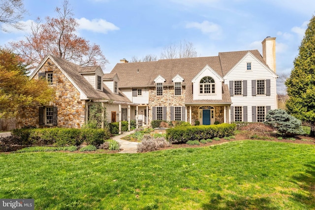 607 Newtown Rd, Berwyn, PA 19312 - rear view of house with a chimney, a yard, and stone siding