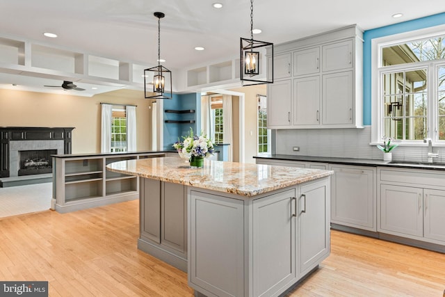 607 Newtown Rd, Berwyn, PA 19312 - kitchen featuring gray cabinetry, plenty of natural light, a sink, and a center island
