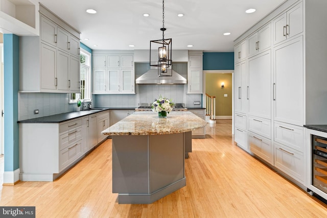 607 Newtown Rd, Berwyn, PA 19312 - kitchen with recessed lighting, light wood-type flooring, a sink, and a center island