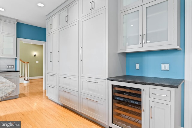 607 Newtown Rd, Berwyn, PA 19312 - bar featuring a dry bar, beverage cooler, recessed lighting, baseboards, and light wood-type flooring