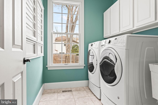 607 Newtown Rd, Berwyn, PA 19312 - laundry room with baseboards, cabinet space, washing machine and dryer, and a healthy amount of sunlight