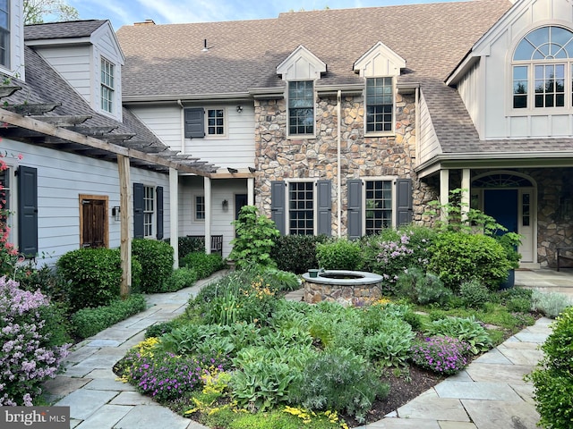 607 Newtown Rd, Berwyn, PA 19312 - exterior space with a pergola, a shingled roof, and stone siding