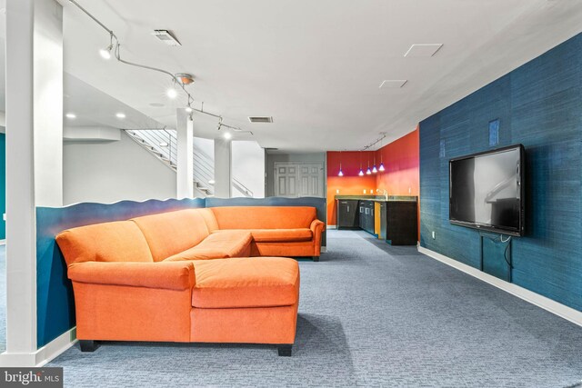 607 Newtown Rd, Berwyn, PA 19312 - living area featuring baseboards, indoor bar, carpet flooring, and stairs
