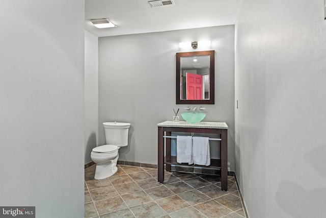 607 Newtown Rd, Berwyn, PA 19312 - half bath with vanity, baseboards, toilet, and visible vents