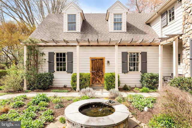 607 Newtown Rd, Berwyn, PA 19312 - new england style home featuring a pergola, a shingled roof, and a fire pit