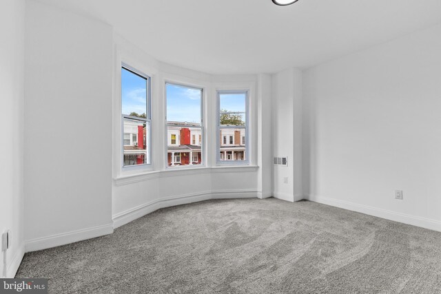 2216 N 4th St, Harrisburg, PA 17110 - carpeted empty room featuring baseboards