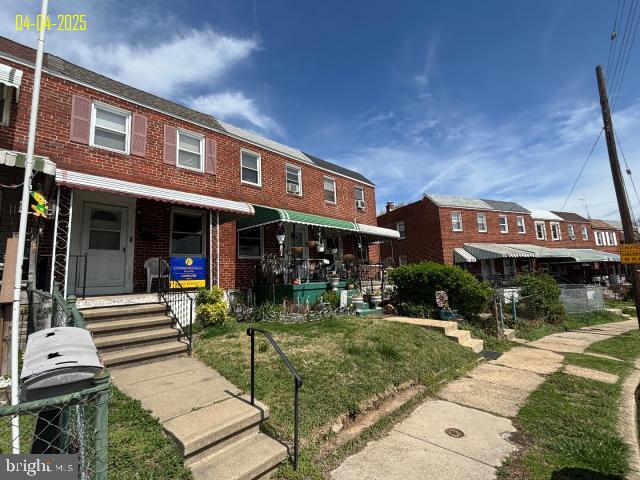 townhome / multi-family property with brick siding