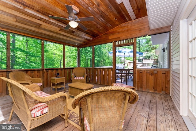 sunroom featuring ceiling fan