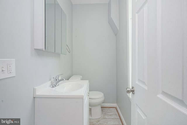 836 State St, Camden, NJ 08102 - bathroom featuring baseboards, vanity, and toilet