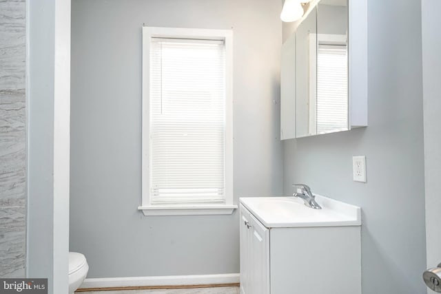 836 State St, Camden, NJ 08102 - bathroom featuring toilet, vanity, and baseboards