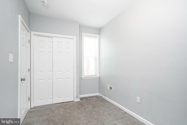 836 State St, Camden, NJ 08102 - unfurnished bedroom featuring carpet floors, a closet, and baseboards