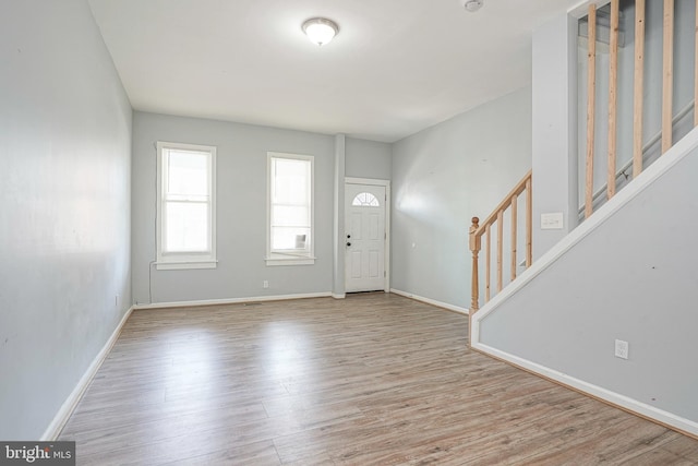 836 State St, Camden, NJ 08102 - foyer featuring stairway, baseboards, and wood finished floors