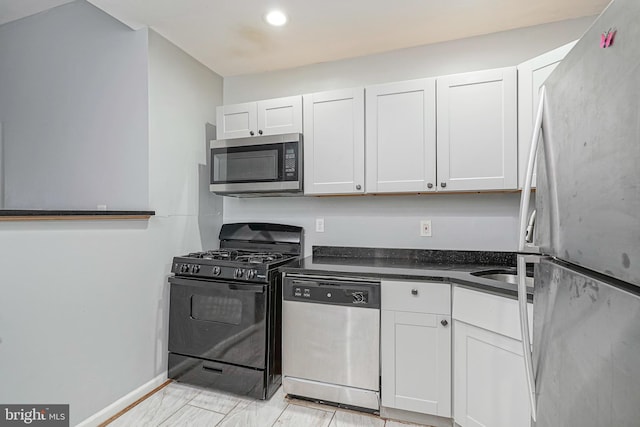 836 State St, Camden, NJ 08102 - kitchen featuring dark countertops, appliances with stainless steel finishes, white cabinets, and recessed lighting
