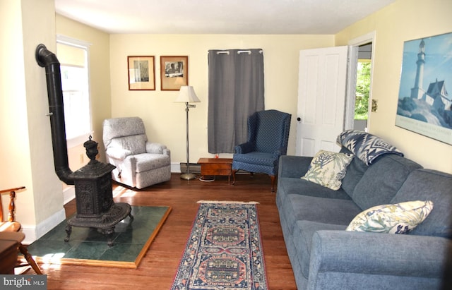 living room with baseboards and wood finished floors