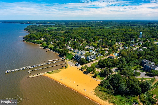 aerial view featuring a water view and a forest view