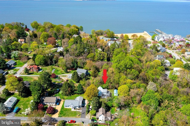 birds eye view of property with a residential view and a water view