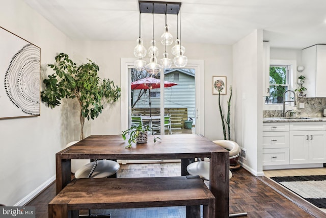 7836 Heritage Dr, Annandale, VA 22003 - dining space with baseboards, a chandelier, and dark wood-style floors