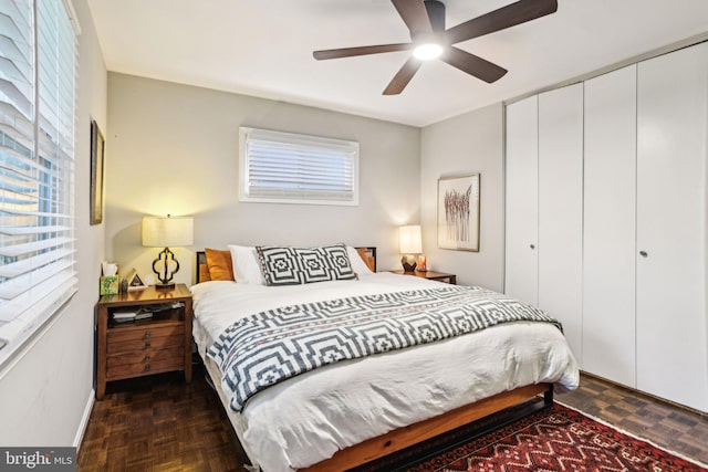 7836 Heritage Dr, Annandale, VA 22003 - bedroom with multiple windows, a closet, baseboards, and a ceiling fan