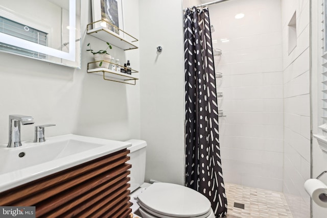 7836 Heritage Dr, Annandale, VA 22003 - bathroom featuring toilet, tiled shower, and vanity