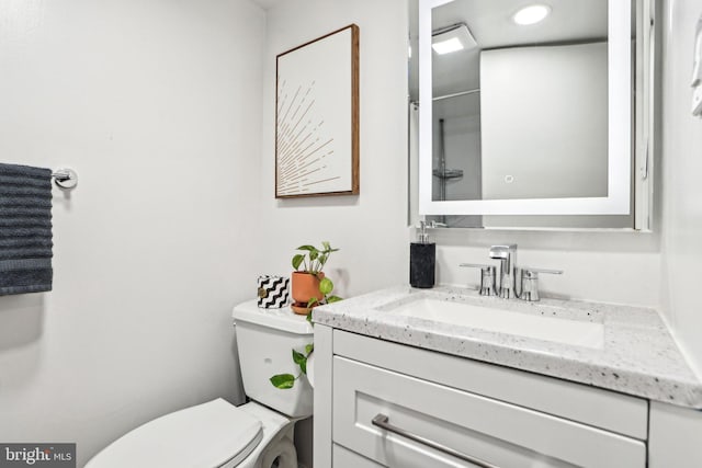 7836 Heritage Dr, Annandale, VA 22003 - bathroom with toilet, vanity, and recessed lighting