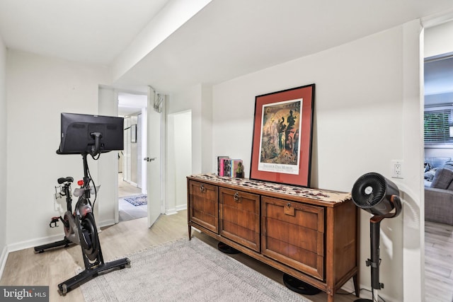 7836 Heritage Dr, Annandale, VA 22003 - workout room with light wood-style flooring and baseboards