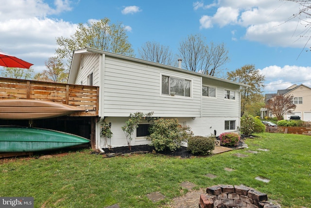 7836 Heritage Dr, Annandale, VA 22003 - view of property exterior featuring an outdoor fire pit, a lawn, and a wooden deck