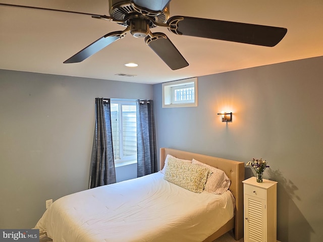 bedroom featuring visible vents and ceiling fan
