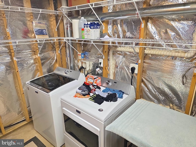 clothes washing area with laundry area and independent washer and dryer