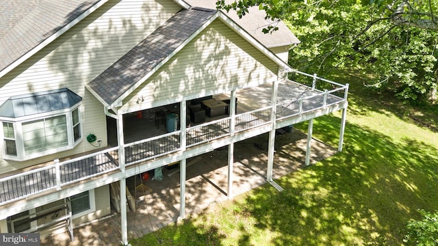 6707 Burch Hill Rd, Brandywine, MD 20613 - view of home's exterior featuring a shingled roof, a wooden deck, a yard, and a patio area