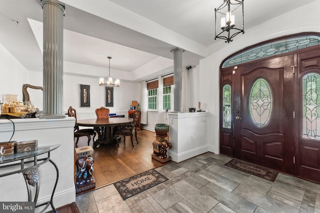 6707 Burch Hill Rd, Brandywine, MD 20613 - entryway with ornate columns, a chandelier, baseboards, and stone finish flooring
