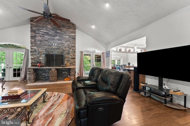 6707 Burch Hill Rd, Brandywine, MD 20613 - living area with a ceiling fan, a textured ceiling, wood finished floors, a fireplace, and high vaulted ceiling
