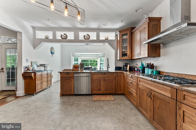 6707 Burch Hill Rd, Brandywine, MD 20613 - kitchen featuring wall chimney exhaust hood, appliances with stainless steel finishes, a sink, brown cabinets, and healthy amount of natural light