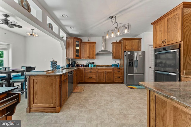 6707 Burch Hill Rd, Brandywine, MD 20613 - kitchen with stainless steel appliances, wall chimney exhaust hood, brown cabinets, dark stone countertops, and glass insert cabinets