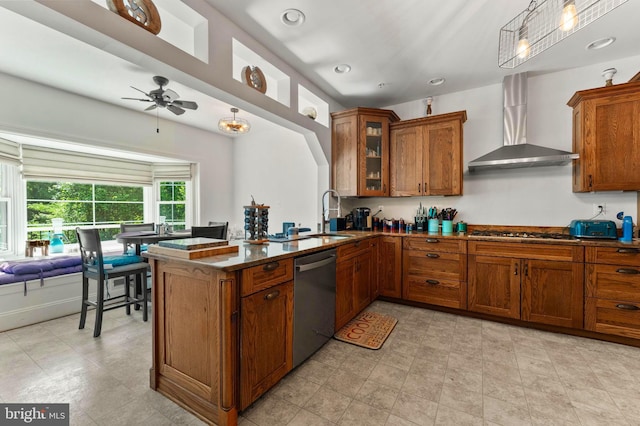 6707 Burch Hill Rd, Brandywine, MD 20613 - kitchen featuring appliances with stainless steel finishes, a sink, brown cabinetry, and wall chimney exhaust hood