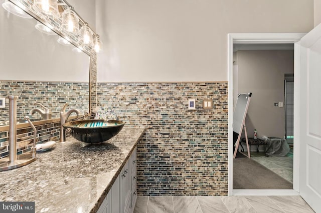 6707 Burch Hill Rd, Brandywine, MD 20613 - bathroom featuring vanity, wainscoting, and tile walls