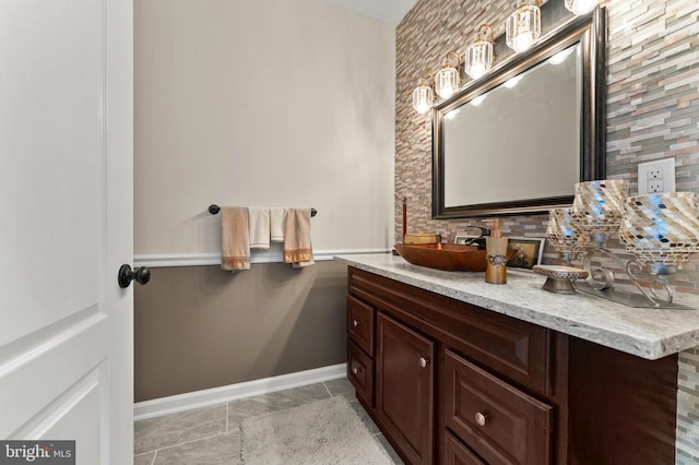 6707 Burch Hill Rd, Brandywine, MD 20613 - bathroom featuring vanity, baseboards, backsplash, and tile patterned floors