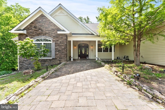 6707 Burch Hill Rd, Brandywine, MD 20613 - craftsman-style home featuring stone siding and covered porch